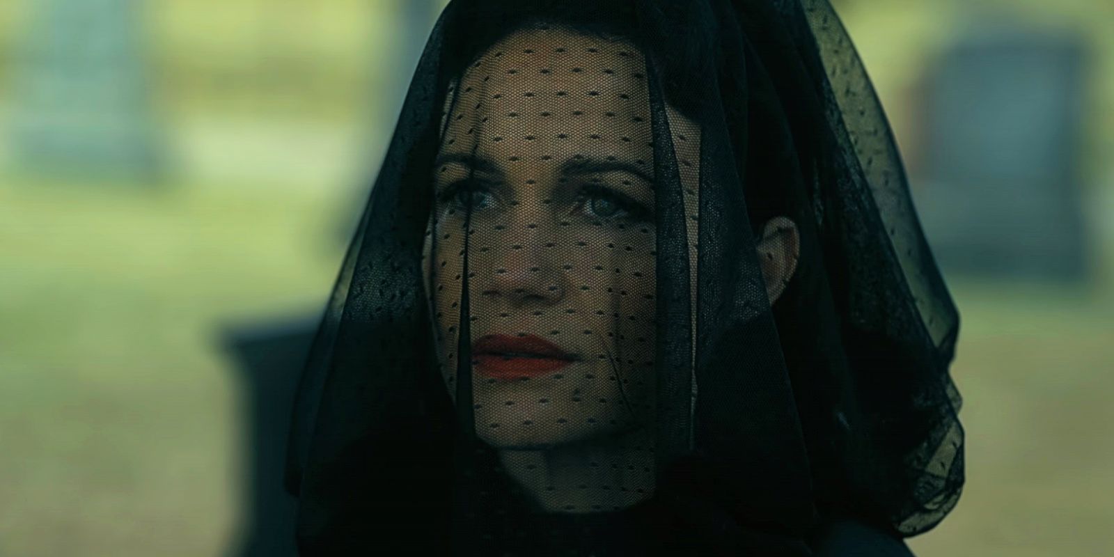 Carla Gugino as Verna standing at the Usher's graves in The Fall of the House of Usher
