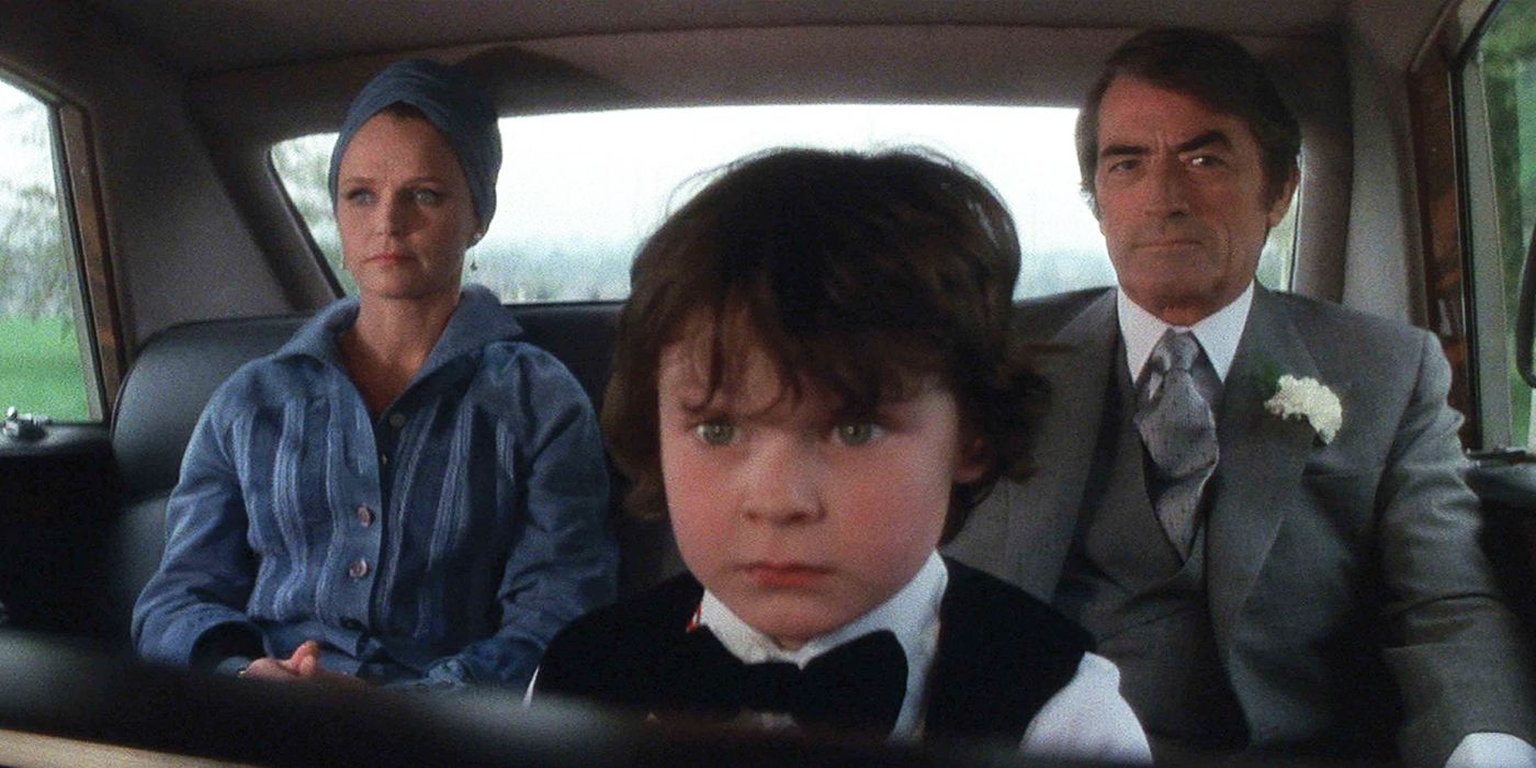 Damien and his parents in a car in The Omen
