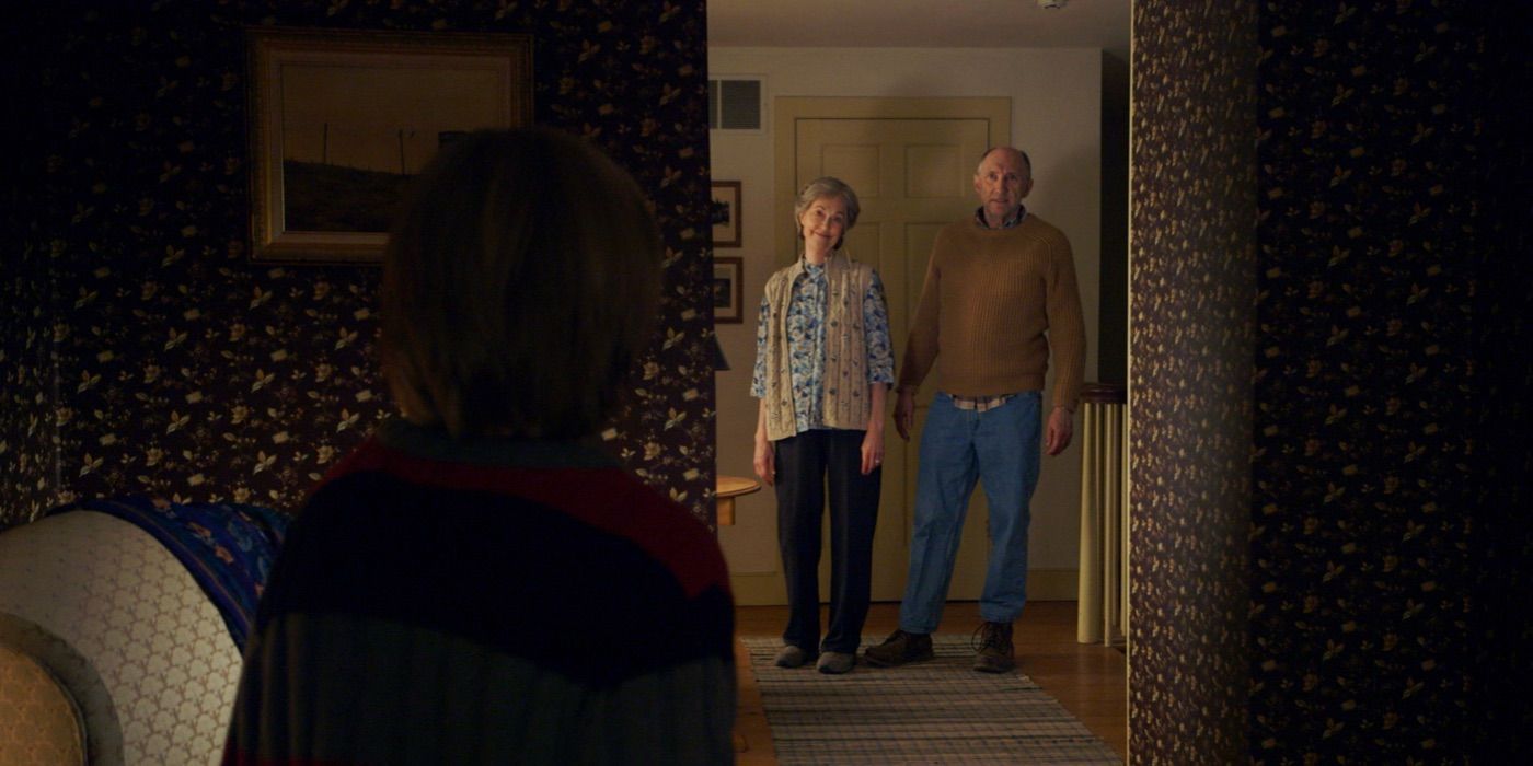 Tyler talks to Nana and Pop Pop through a doorway in The Visit