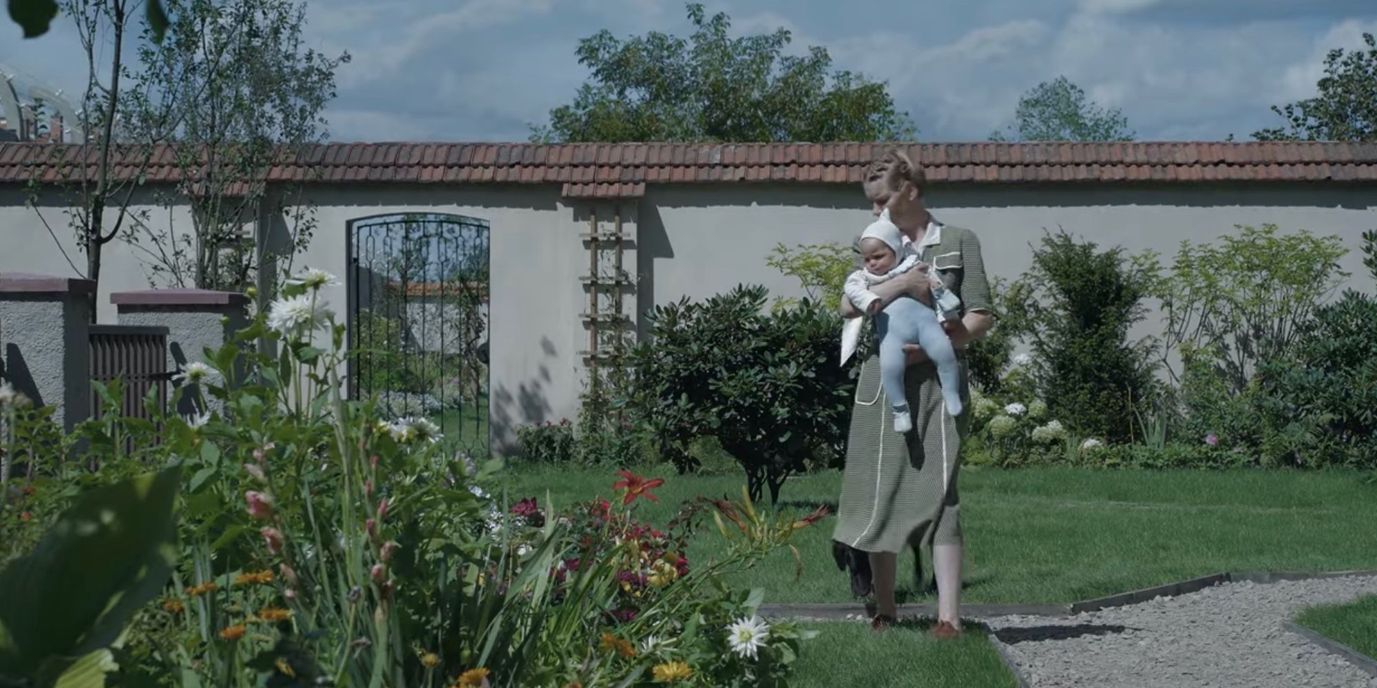 The Zone of Interest Sandra Huller with baby in a garden