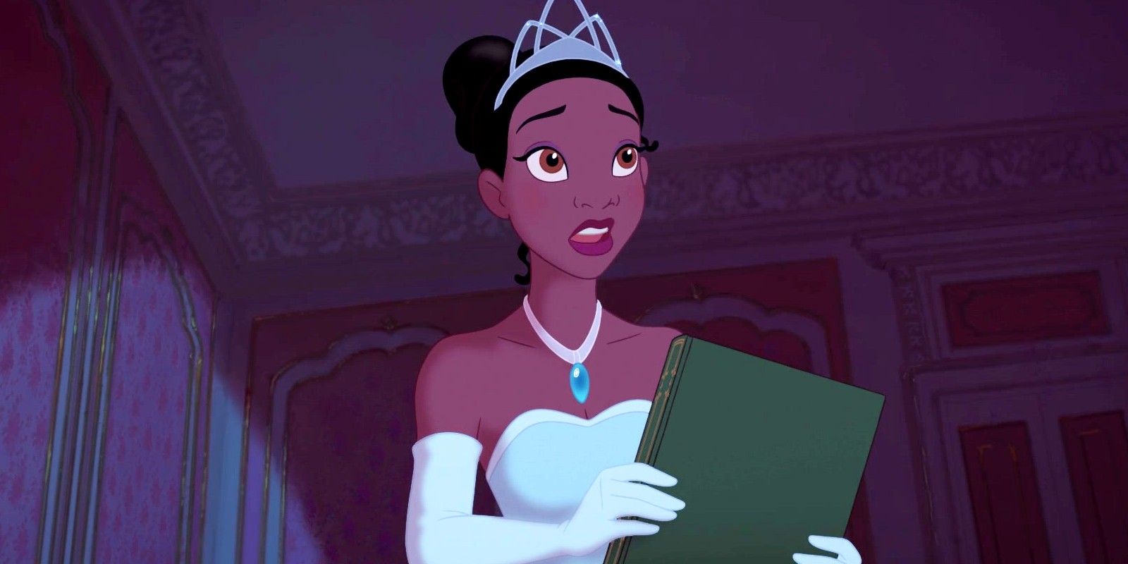 Tiana holding a book in The Princess and the Frog