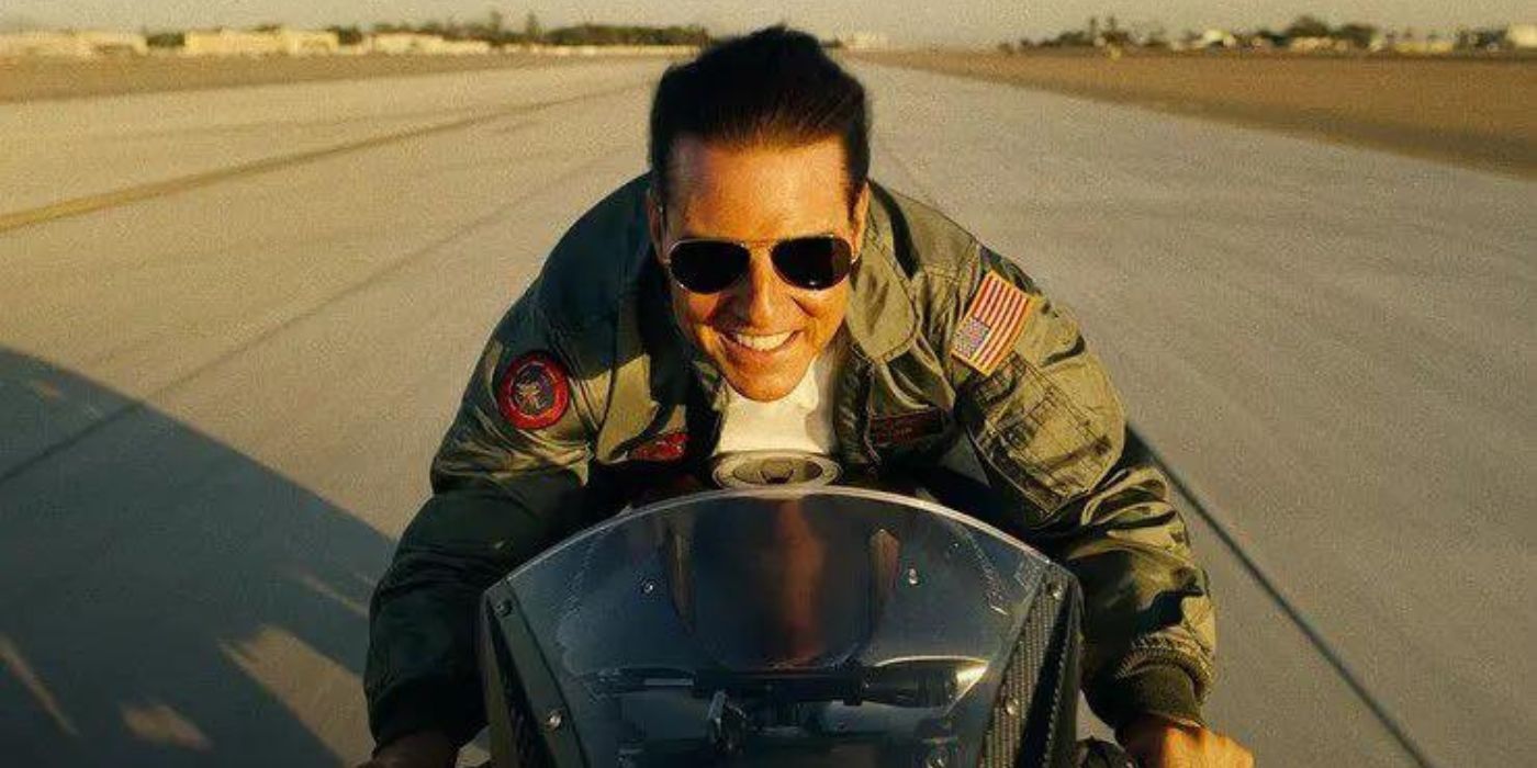 Tom Cruise as Maverick rides a motorcycle in Top Gun: Maverick.