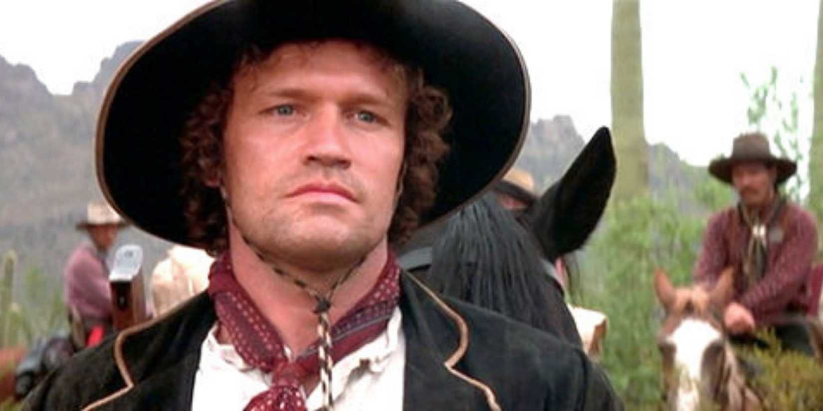 Tombstone - Michael Rooker wearing cowboy outfit in front of others on horseback