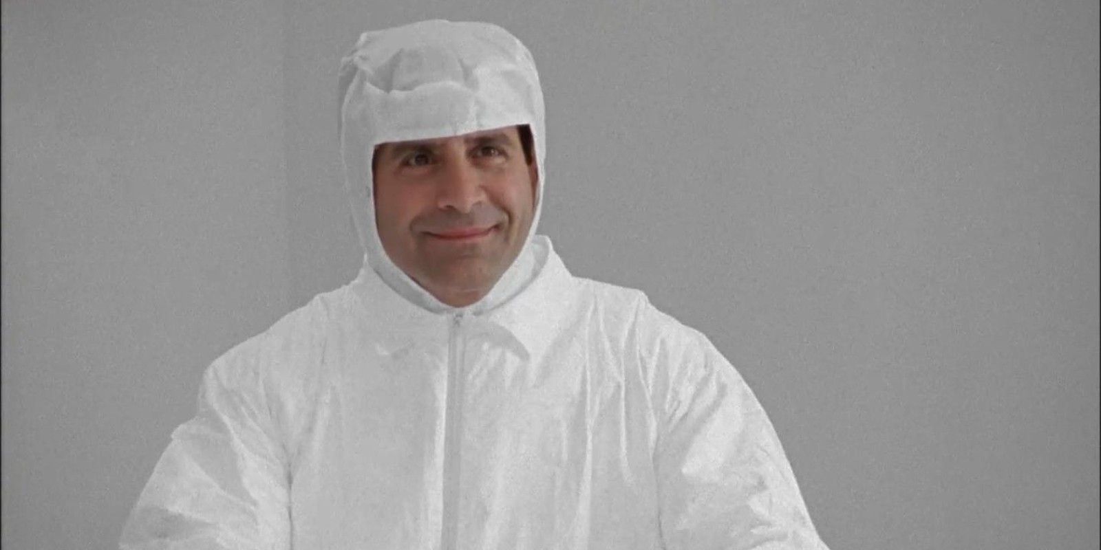 Tony Shalhoub as Adrian Monk in a white jumpsuit in the Monk episode Mr. Monk and the Garbage Strike.