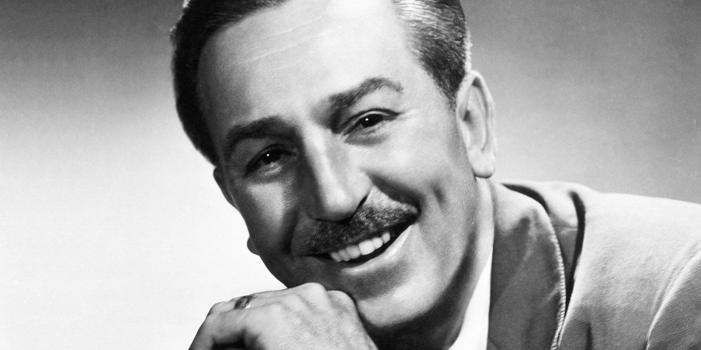 Walt Disney smiling in a black and white photo