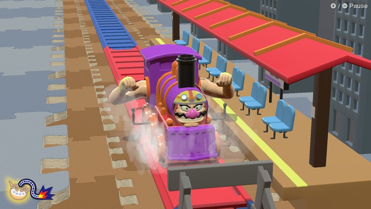 WarioWare Train arriving in a station with human arms and Wario's face on it.
