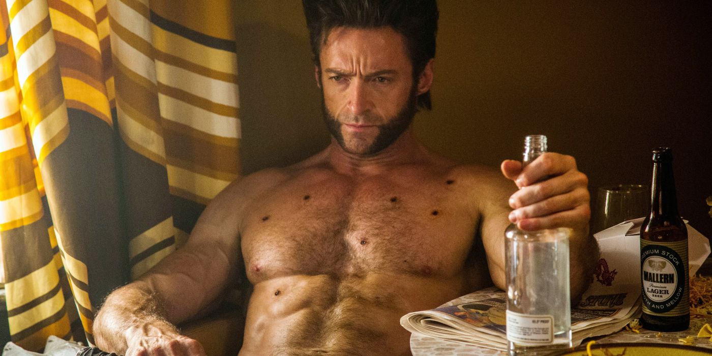 Wolverine (Hugh Jackman) sits with alcohol and bullet holes in X-Men Origins: Wolveirne