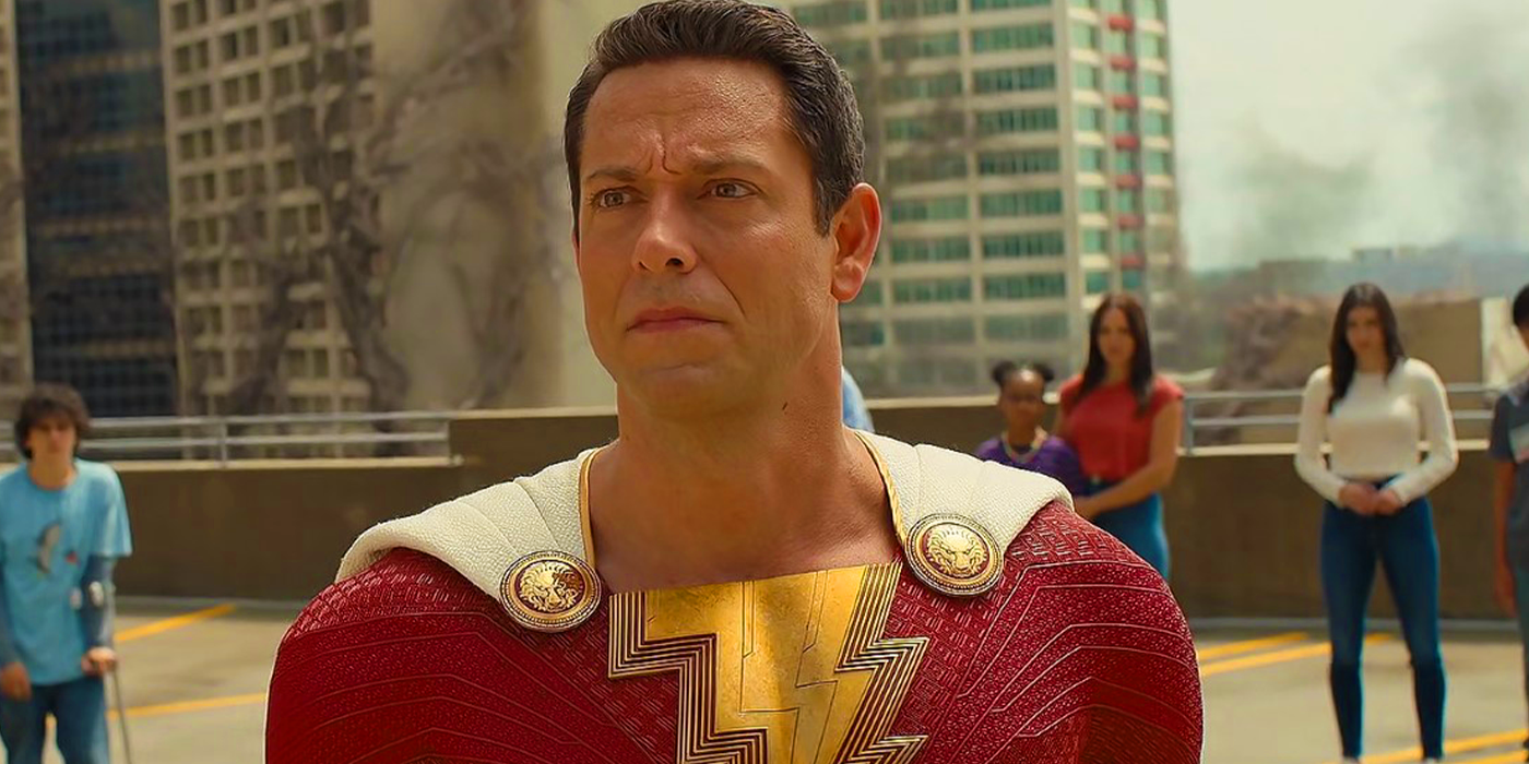 Zachary Levi as Billy Batson is standing on the roof of a building in Shazam! Fury of the Gods