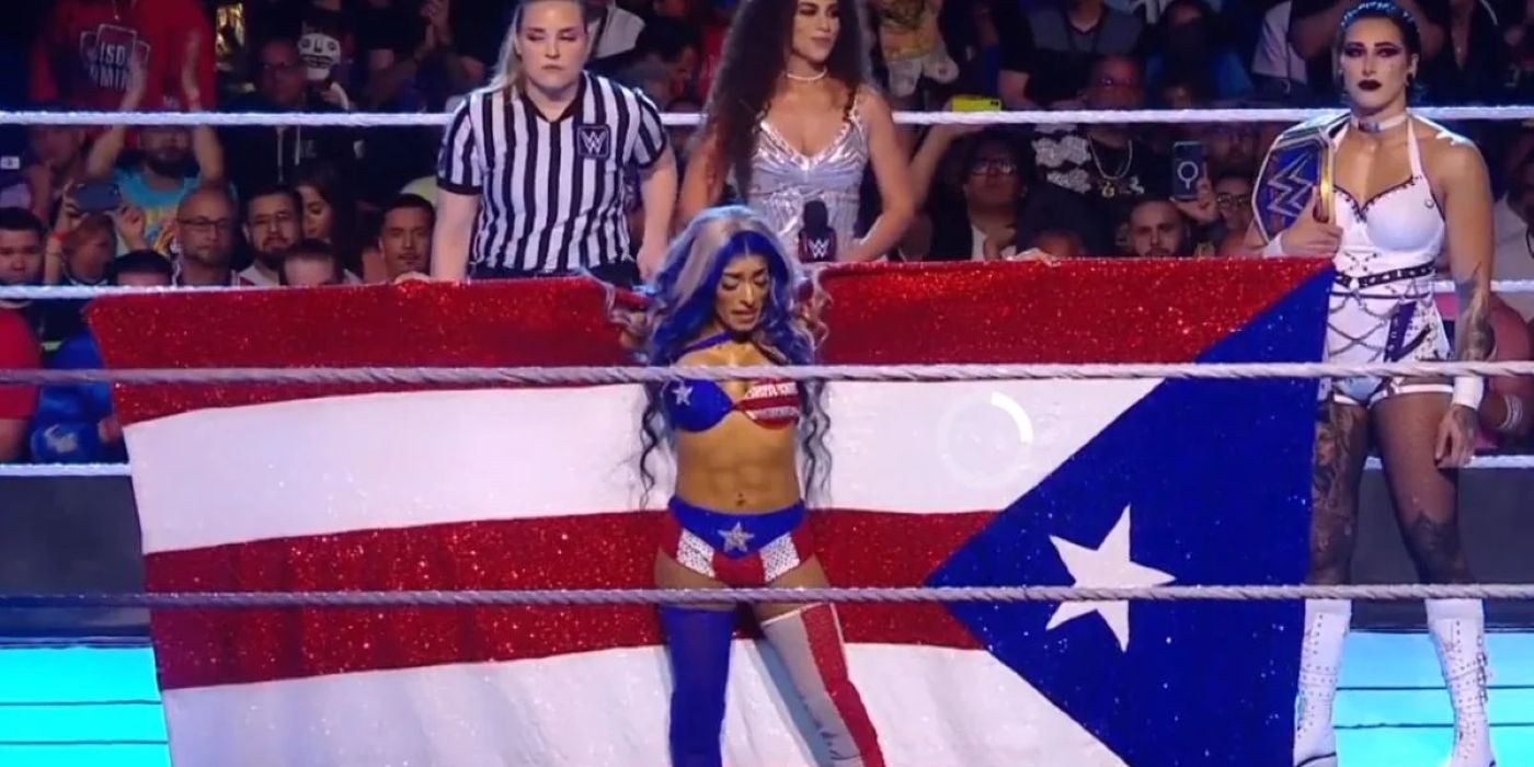Zelina Vega in front of a Puerto Rican flag with Rhea Ripley at Backlash 2023.-1