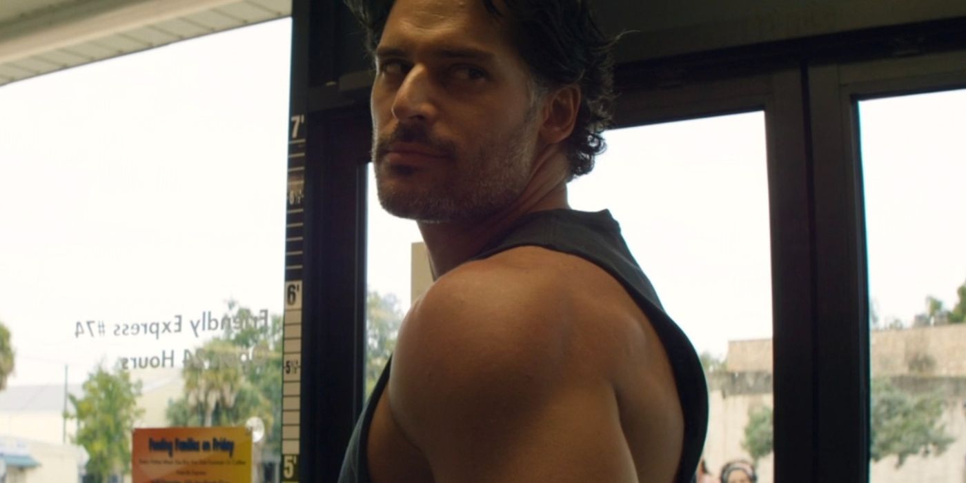 Joe Manganiello as Richie looking over his shoulder in a store in Magic Mike XXL