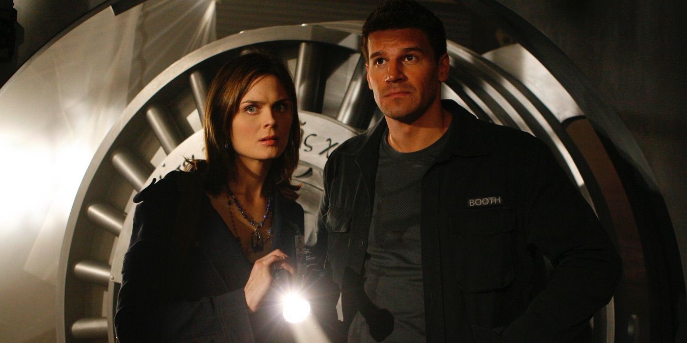 Emily Deschanel and David Boreanaz as Agent Brennan and Agent Booth entering the vault in Bones.