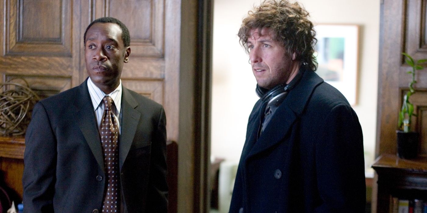 Adam Sandler and Don Cheadle stand next to each other in Reign Over Me