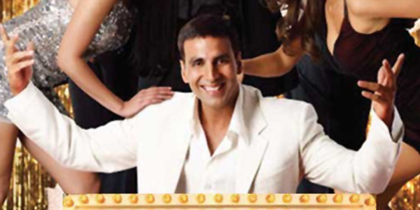 Akshay Kumar as Rajiv Saini with his hands raised and smiling on the cover of Welcome.