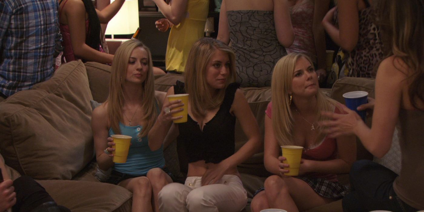 Cindy Busby and friends listening to a story while holding drinks