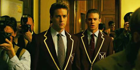 Armie Hammer as Cameron and Tyler Winklevoss around photographers in The Social Network