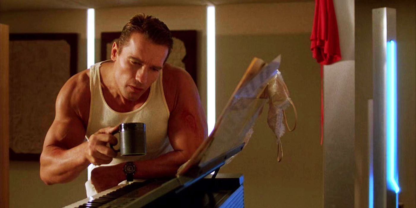 Arnold Schwarzenegger holding a mug and looking at a keyboard piano in The Running Man