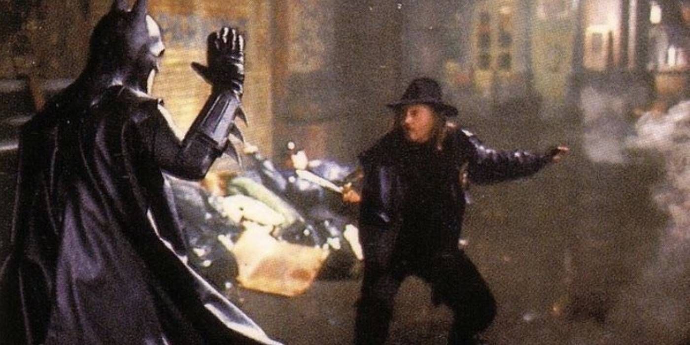 Michael Keaton as Batman fighting with Bob as he wields a knife in Batman (1989)