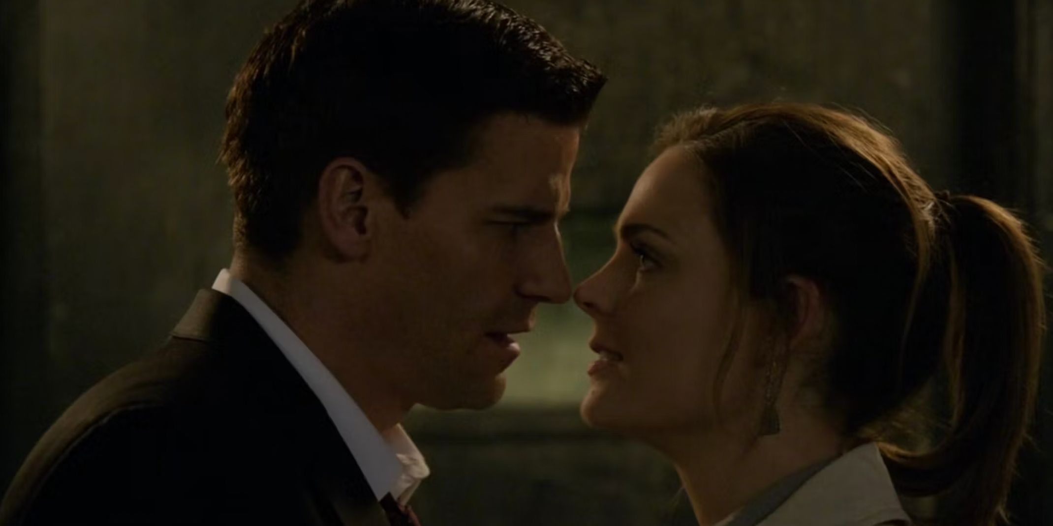Booth and Brennan leaning into one another in Bones