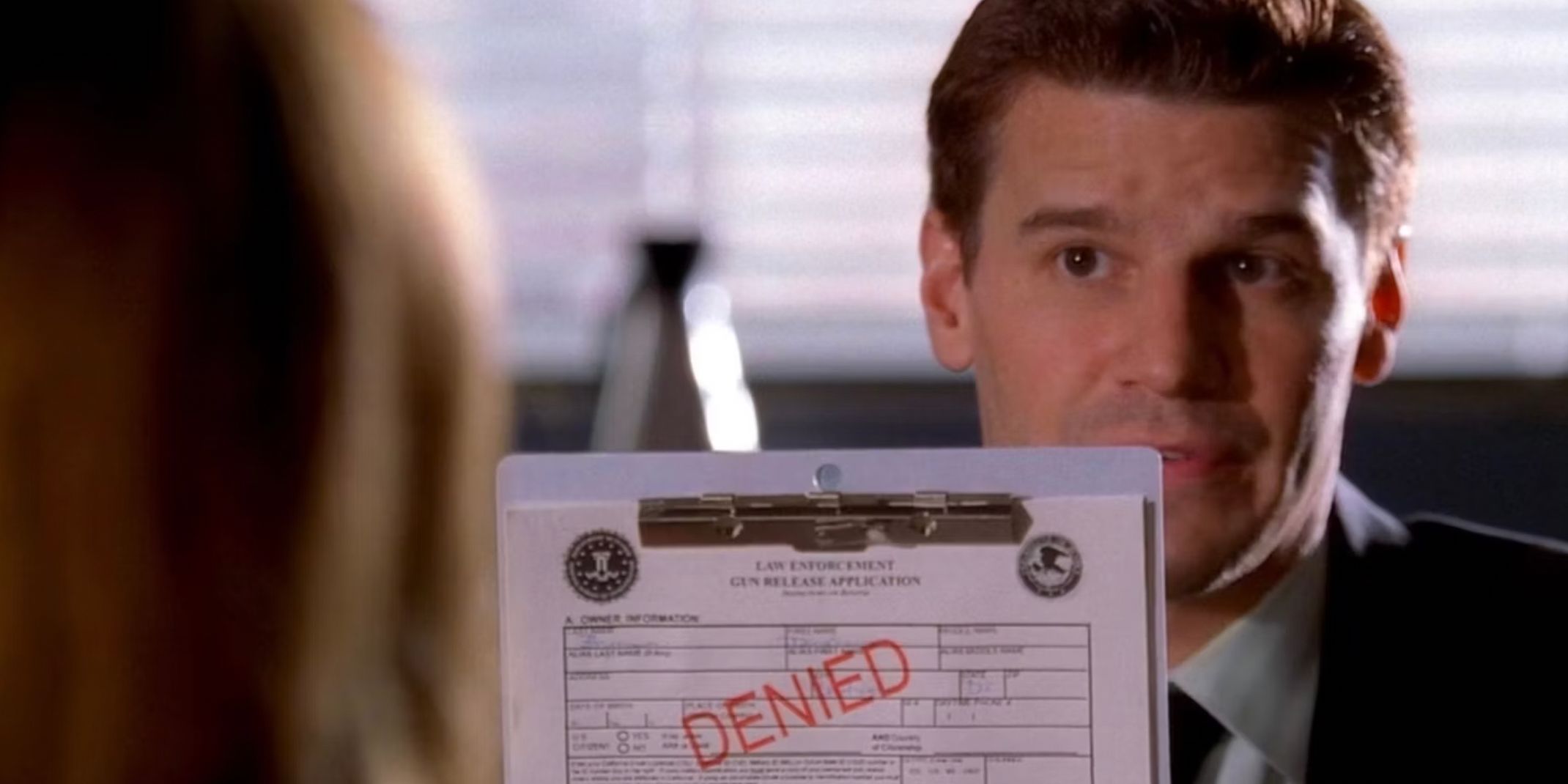 Booth showing Brennan a denied request form in Bones