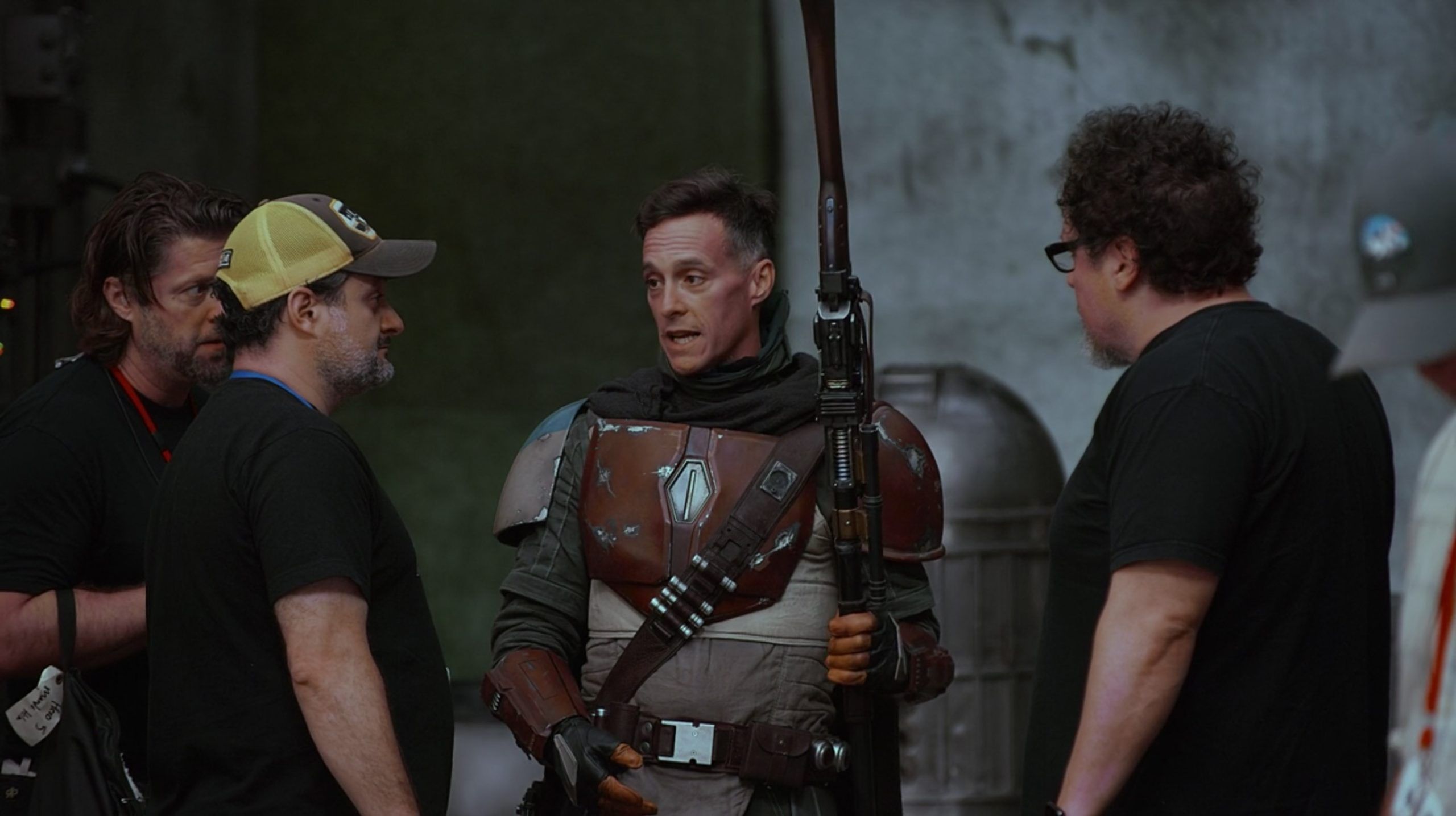 Brendan Wayne as Din Djarin behind the scenes of The Mandalorian season 1 with Jon Favreau and Dave Filoni