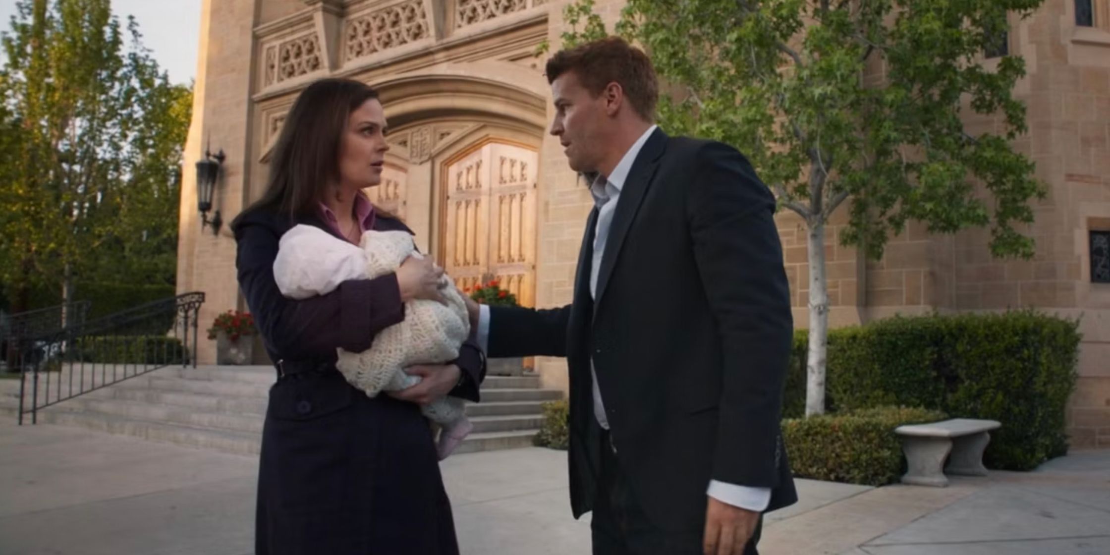 Brennan and Booth with baby Christine outside of a church in Bones