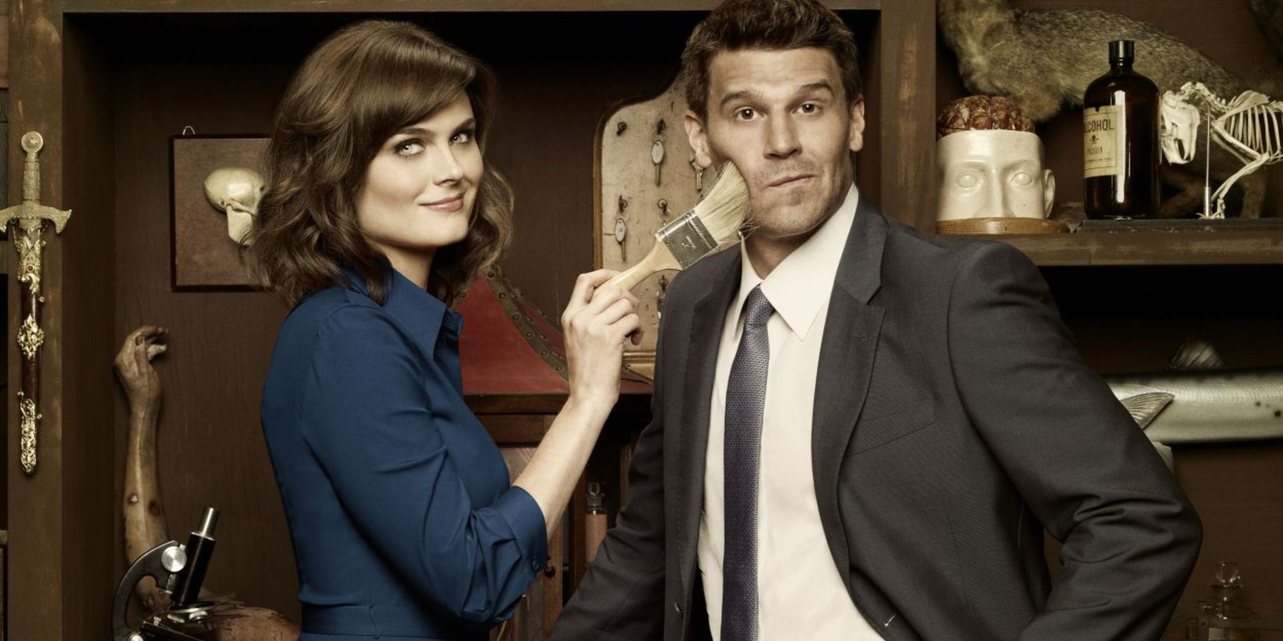 Brennan brushing Booths face in a promotional image for Bones