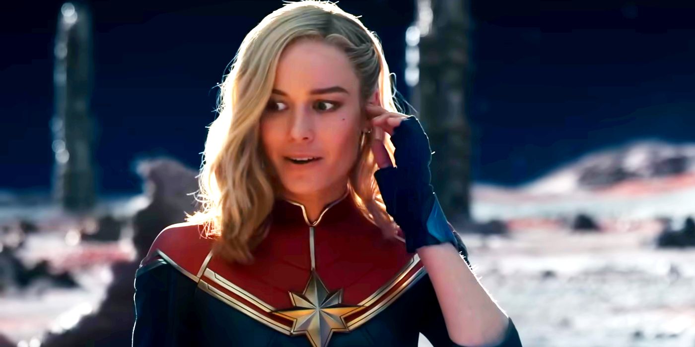 Brie Larson as Captain Marvel with a Hand to Her Ear in The Marvels