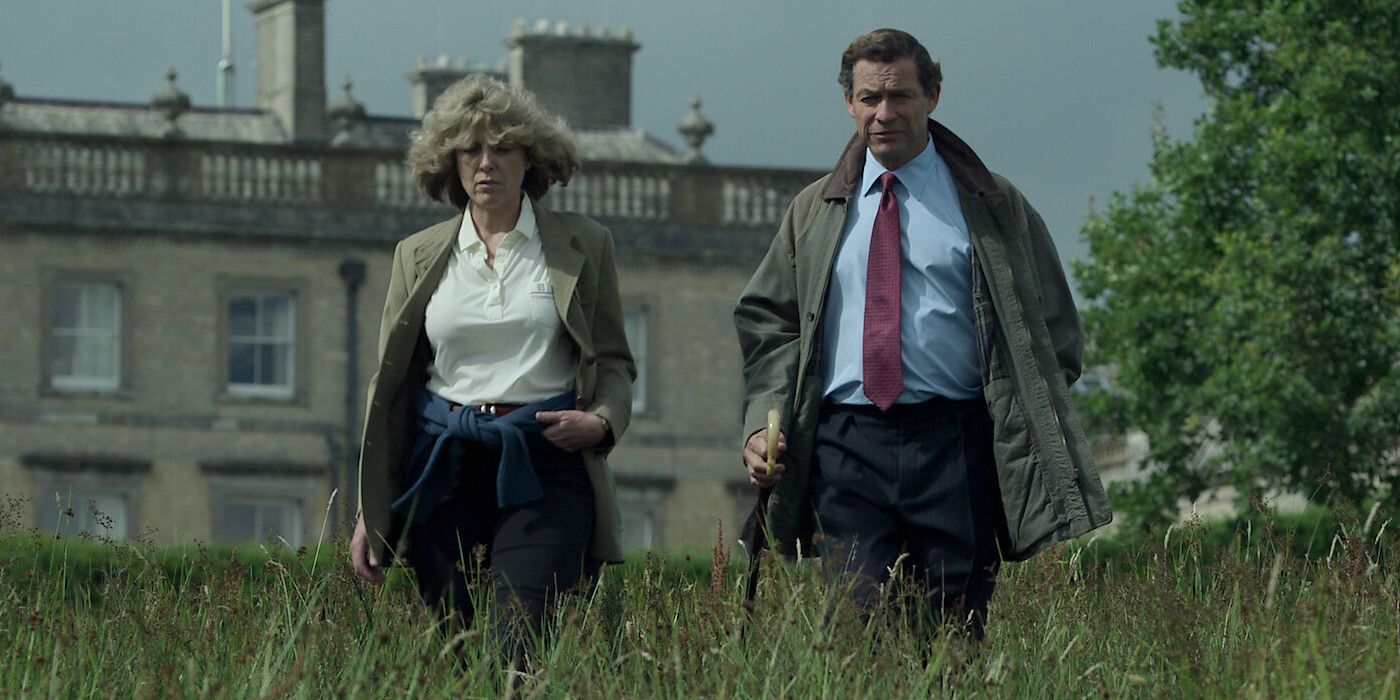 Camilla (Olivia Williams) & Prince Charles (Dominic West) walking through a field in in The Crown