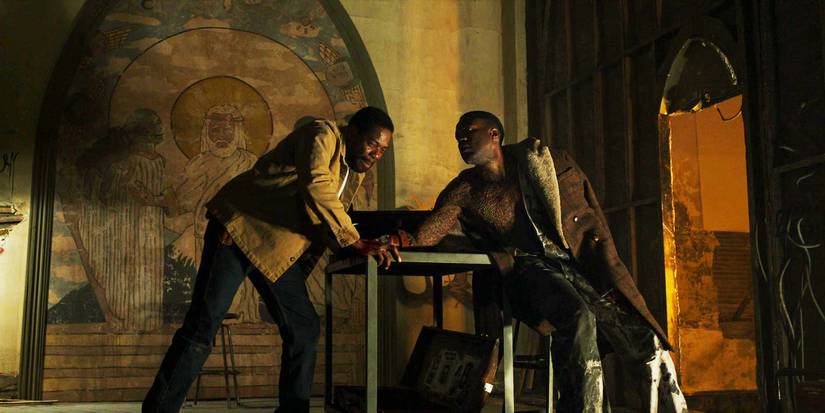 Candyman 2021 William cutting Anthony's hand at an abandonded church
