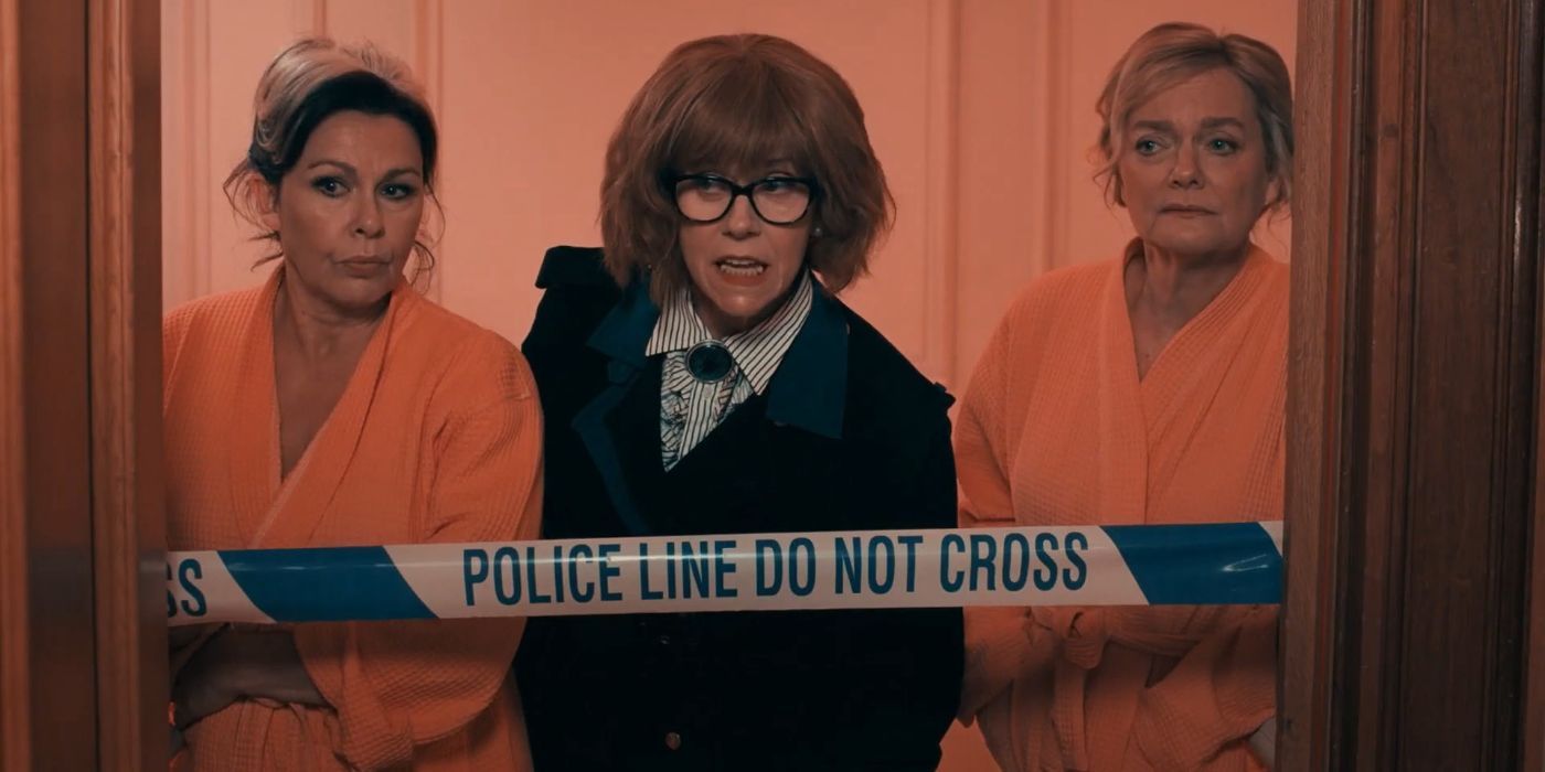Cat Stone, Jane Stone, and Beth Stone standing behind a police barrier in Queens of Mystery.