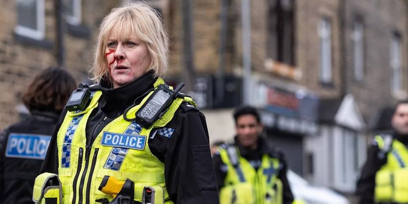 Catherine walking away from a crowded crime scene with blood running down her face in Happy Valley season 3.