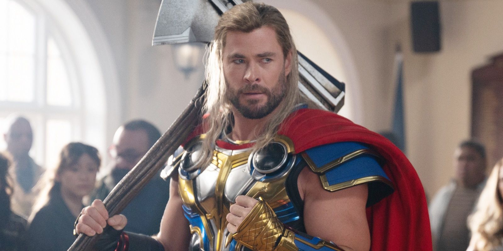 Chris Hemsworth as Thor holds Stormbreaker