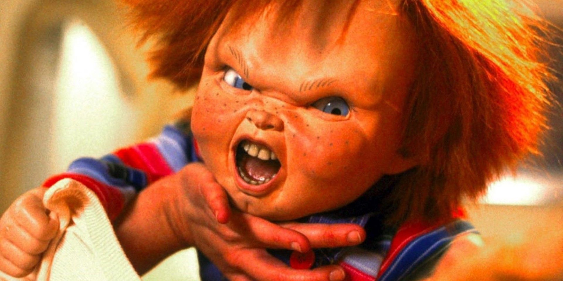 Chucky looking angry in the middle of a fight in the original Child's Play