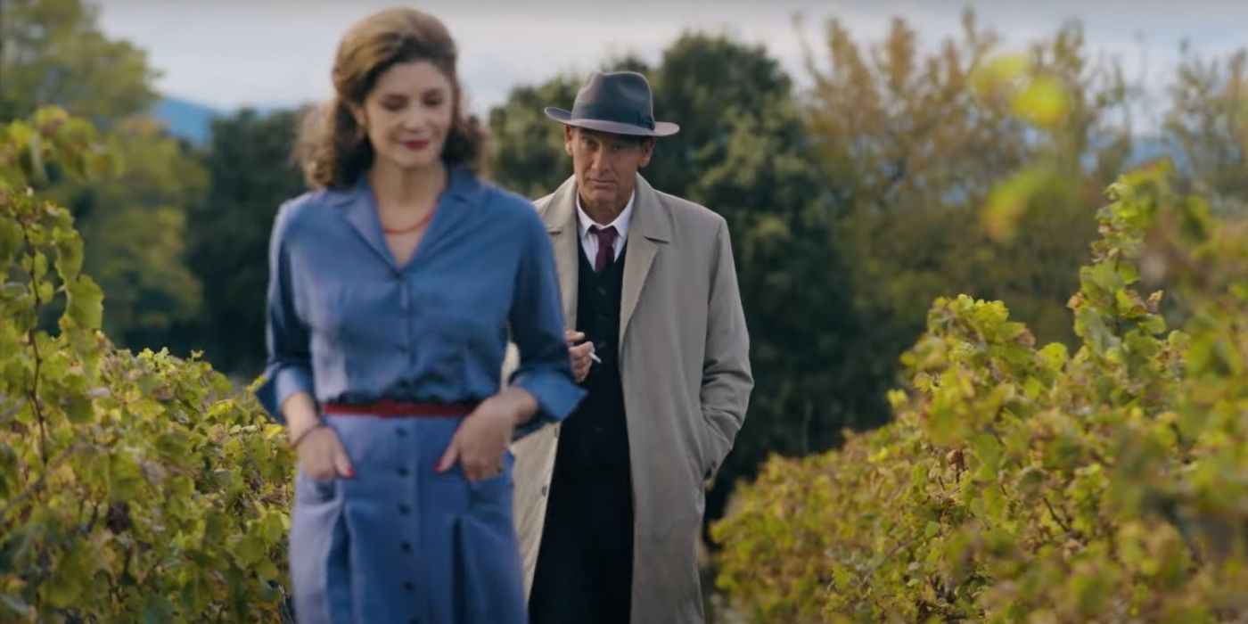 Clive Owen walking behind a woman in a vinyard in Monsieur Spade.