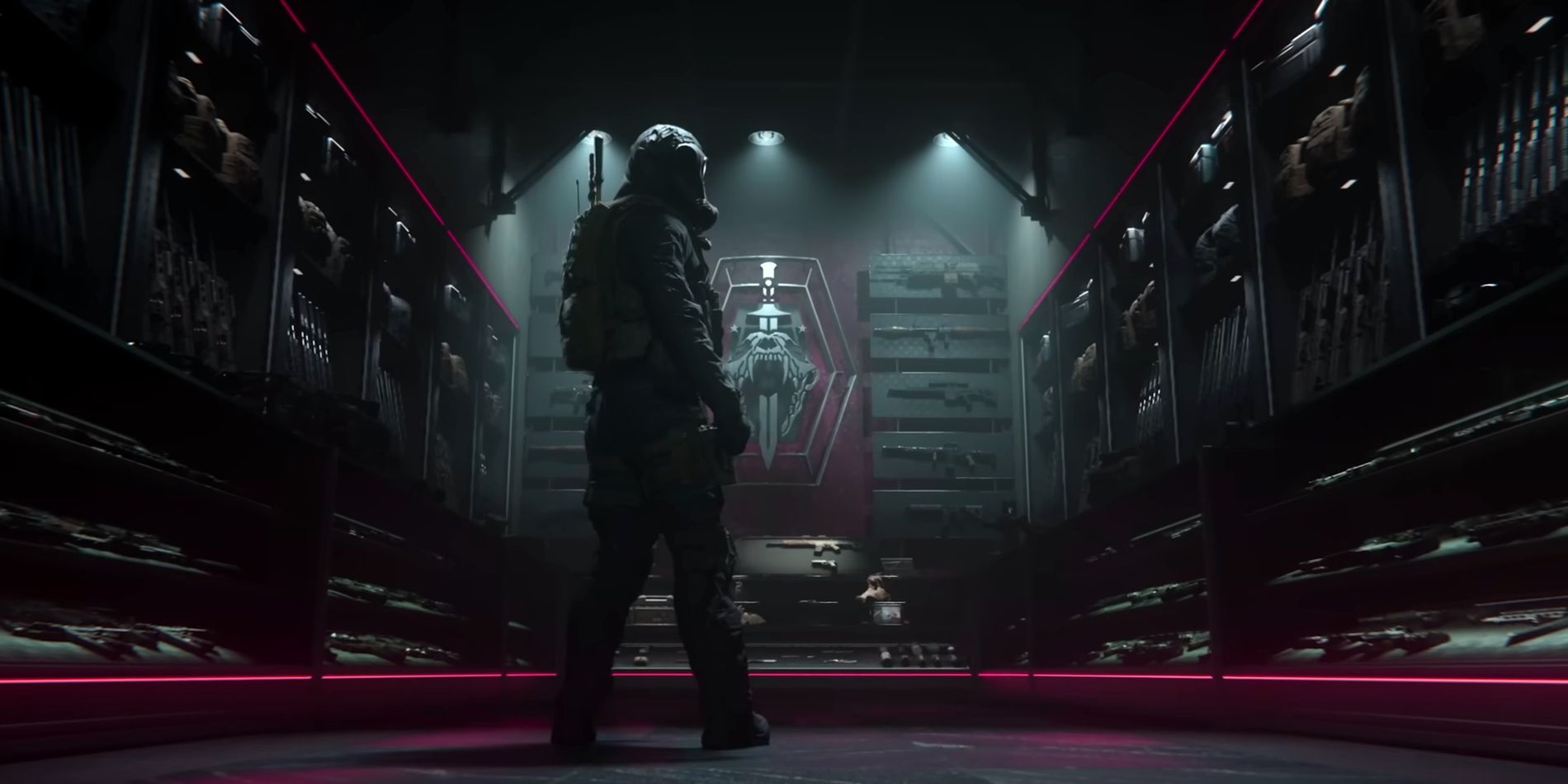 Screenshot from MW3 multiplayer trailer shows a masked soldier standing in the middle of an armory filled with a wide selection of guns and war gear.