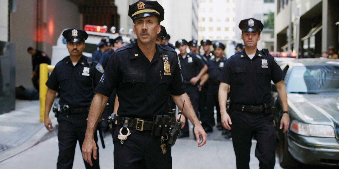 Nicolas Cage and other cop characters staring at something ahead in World Trade Center