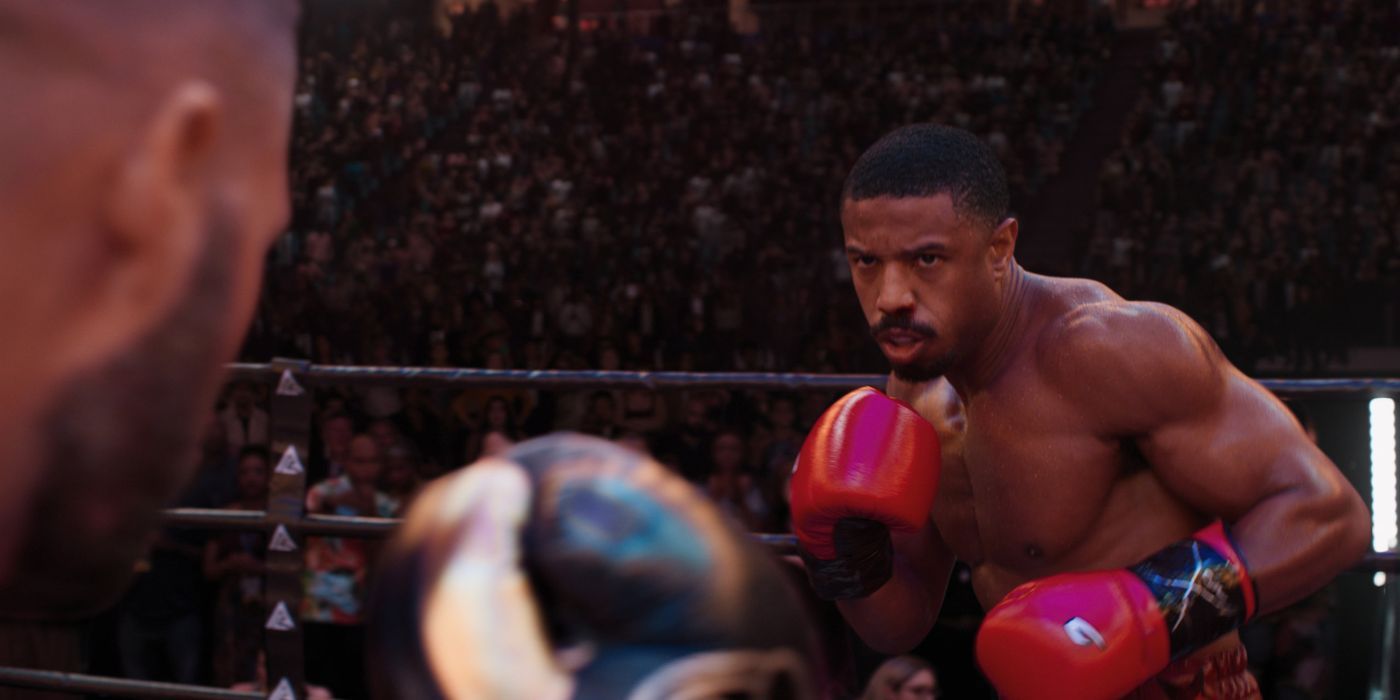 Adonis Creed focused and sizing up his opponent before launching his next attack in Creed III's opening