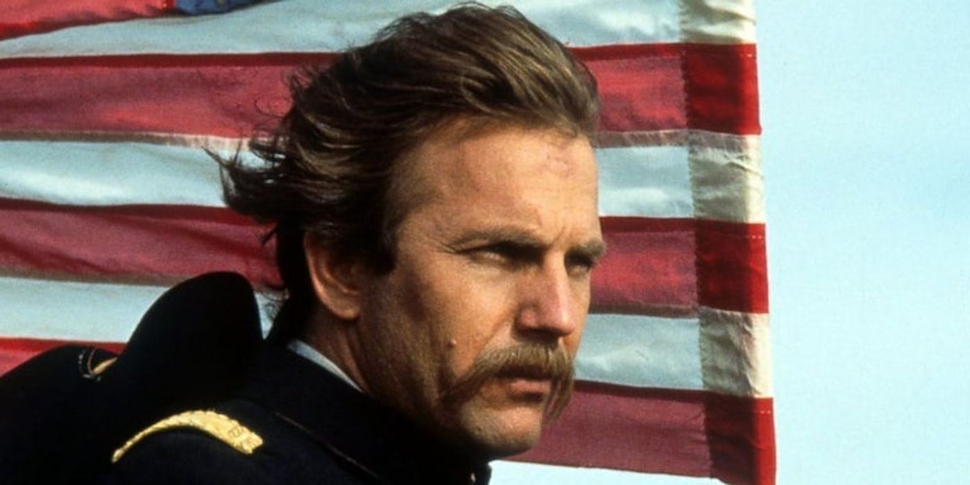Dunbar standing in front of an American Flag in Dances With Wolves 