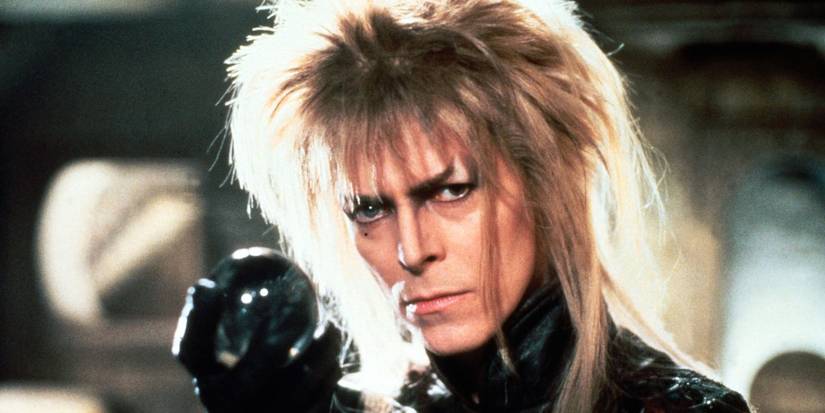 David Bowie as Jareth the Goblin King holding a small orb in Labyrinth