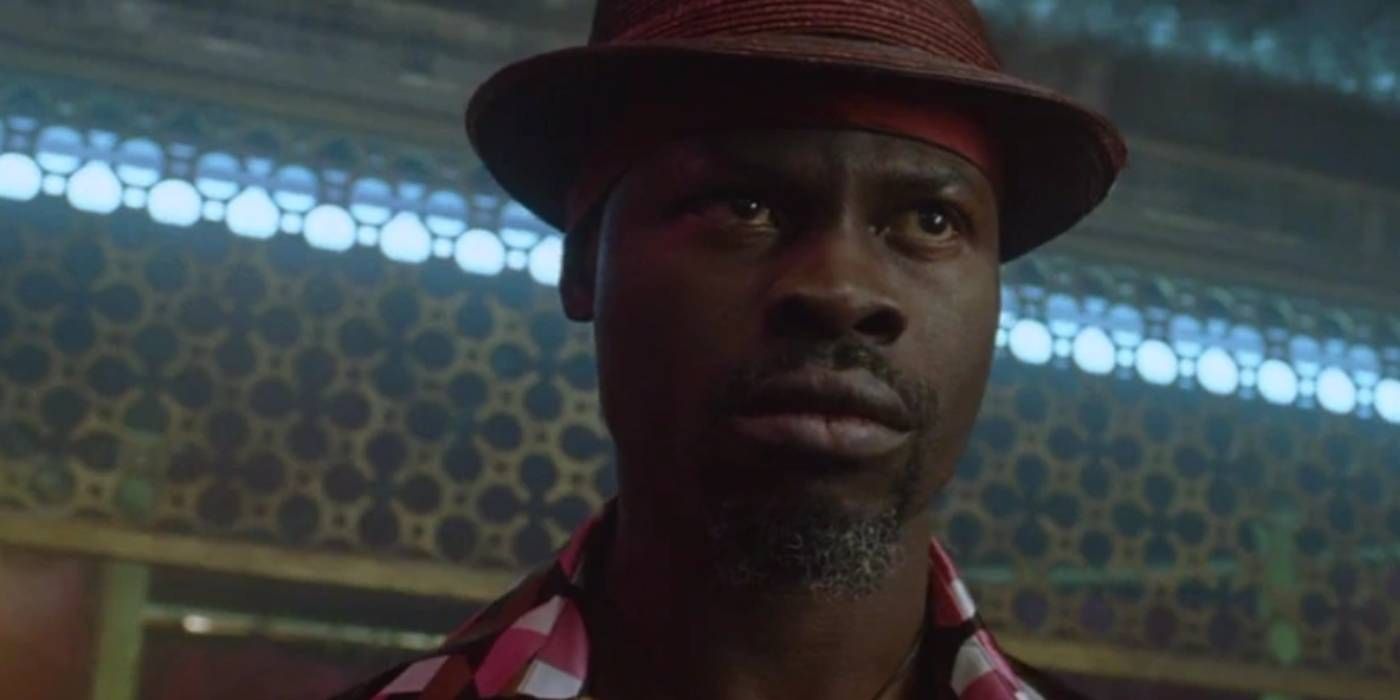 Djimon Hounsou's Papa Midnite in a tense scene in Constantine