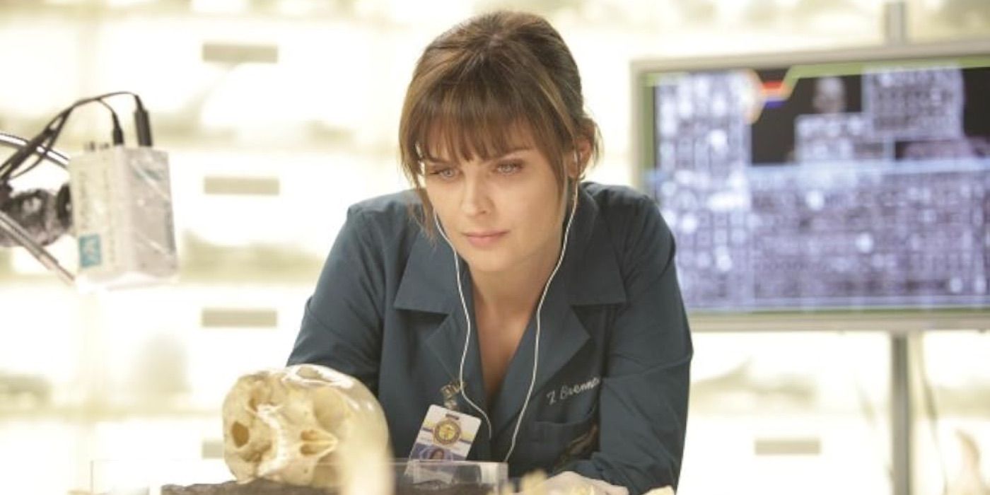 Emily Deschanel as Agent Brennan examining a skull in Bones