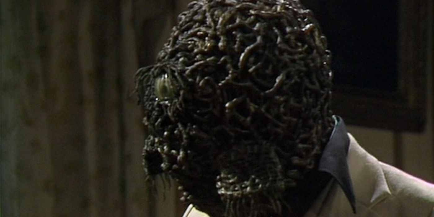 Doctor Who: the Jagaroth covering a face attached to a white coat