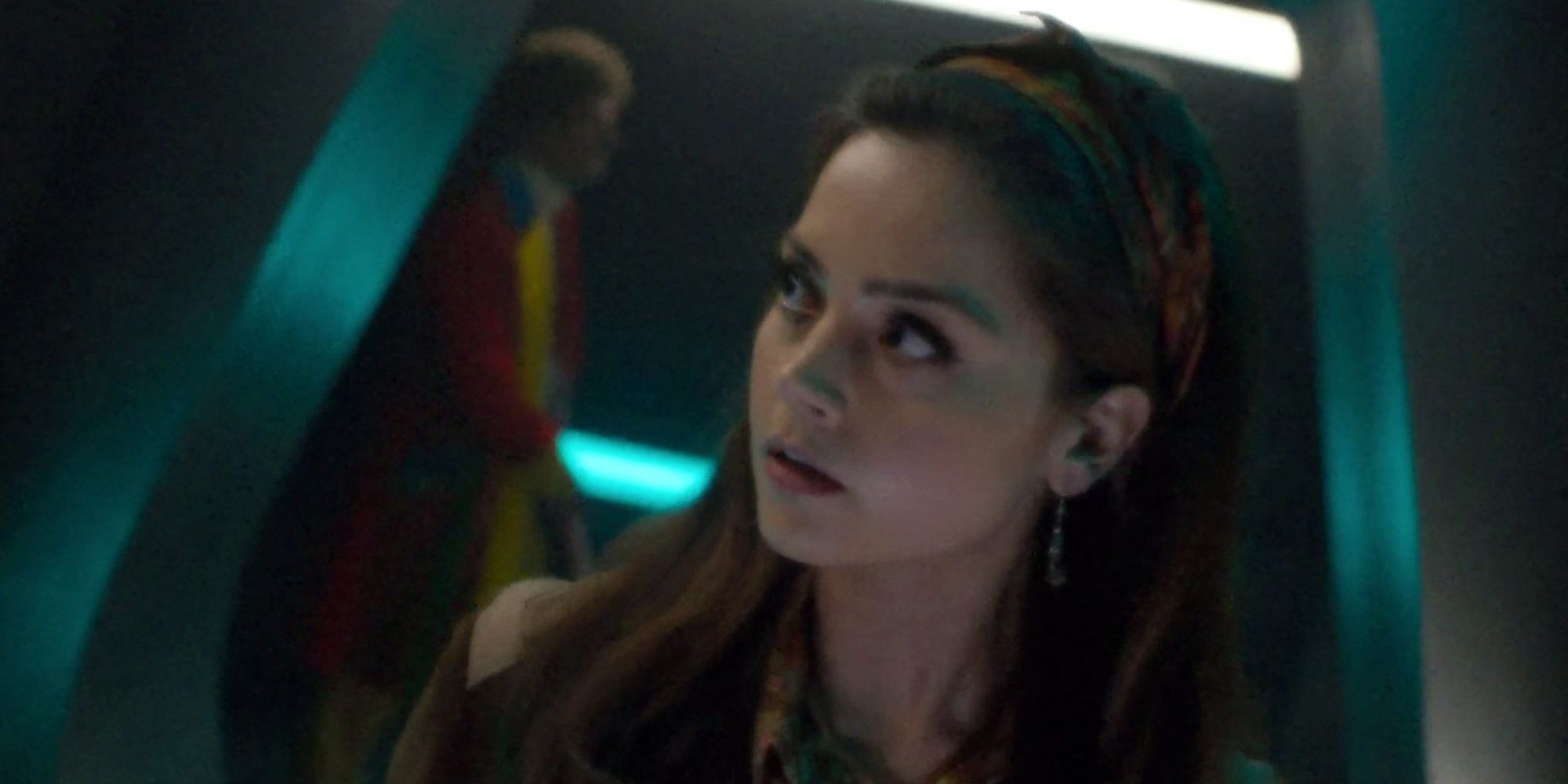 Jenna Coleman as Clara in the TARDIS with the Sixth Doctor walking behind her in Doctor Who's "The Name of the Doctor."