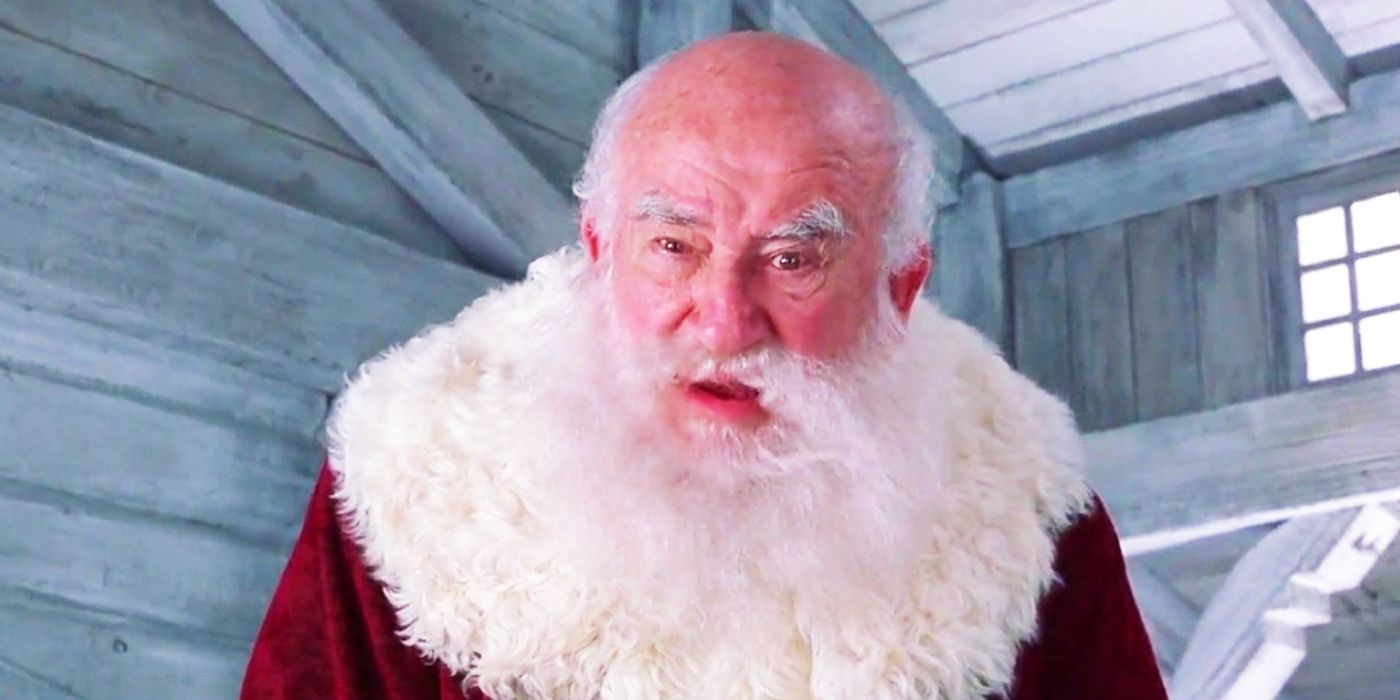 Ed Asner dressed as Santa with his mouth slightly open in confusion in Elf.