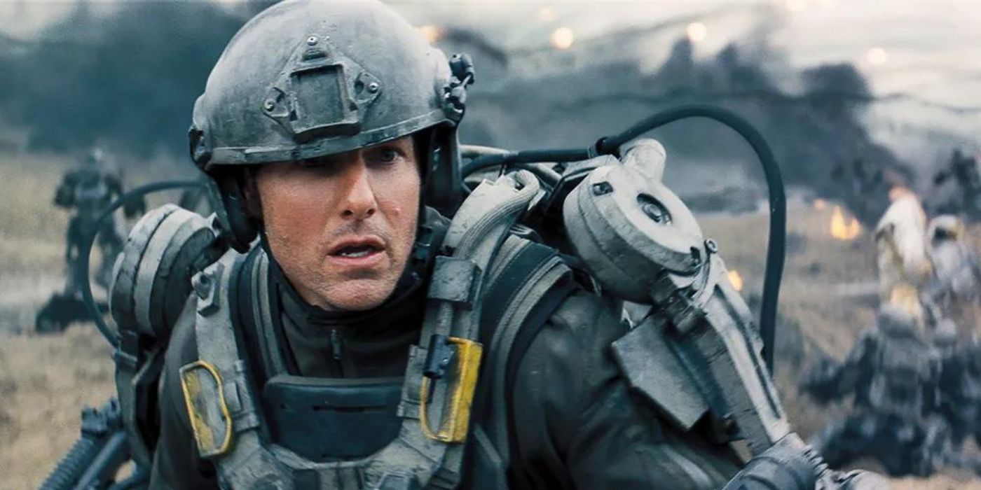 Tom Cruise, como Major William Cage, fica chocado com os horrores da guerra em Edge of Tomorrow de 2014
