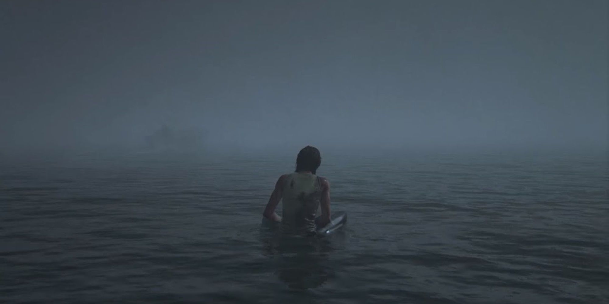 Ellie sits in the water in The Last of Us Part II
