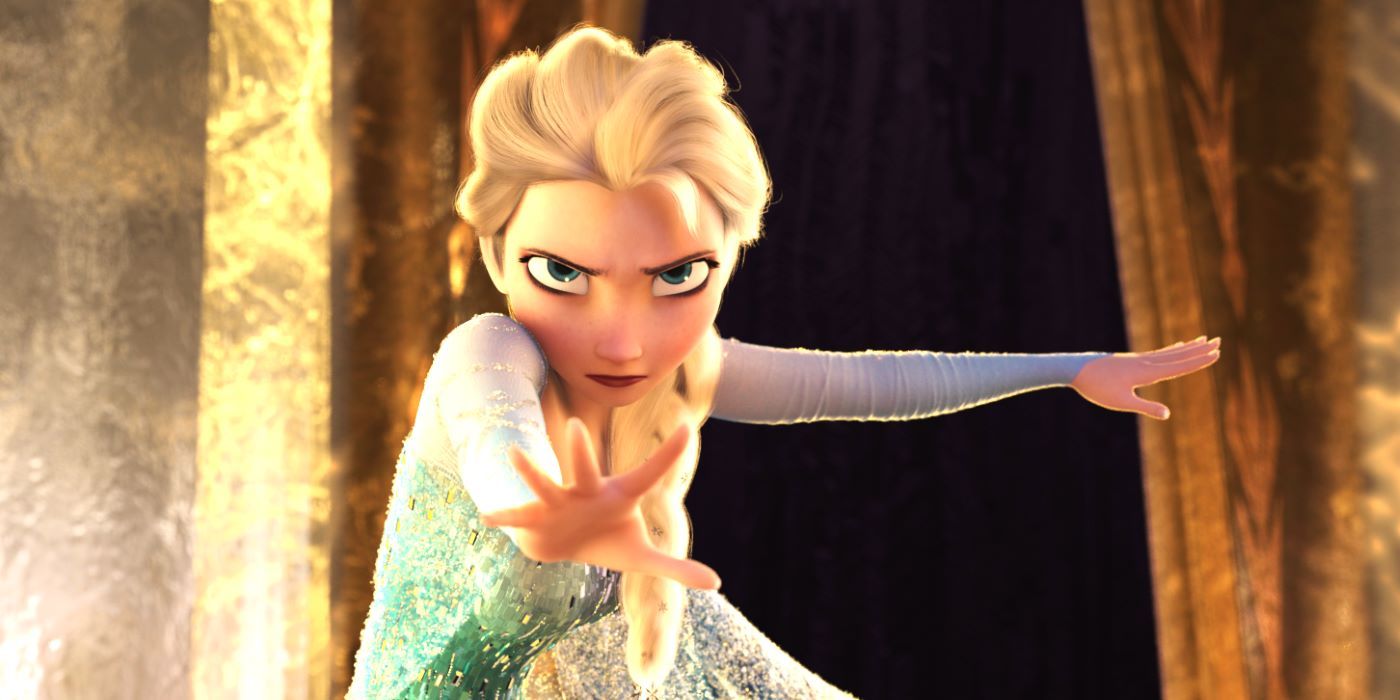 Elsa (Idina Menzel) frowning with her hand outstretched as a gesture to halt in Frozen (2013).