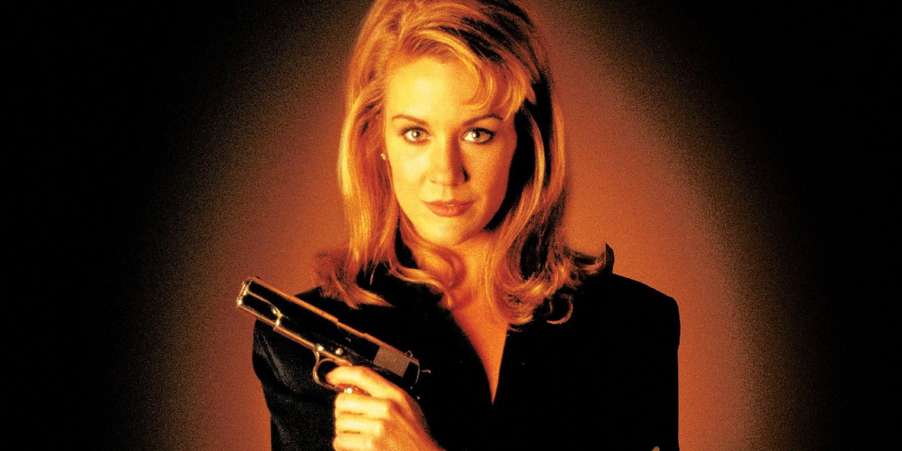 A woman holding a gun in the poster for Excessive Force 2: Force on Force.