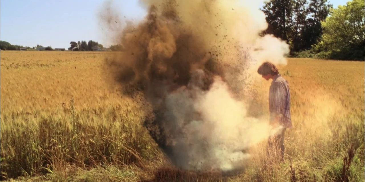 An exploding hole with a kid standing next to it in Smallville.