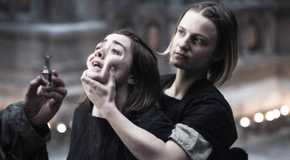 Faye Marsay as The Waif in Game of Thrones holding Arya's face